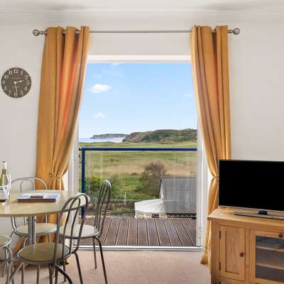 Surf Deck - Lovely Apartment, Spectacular Coastal Views, Short Walk to Beach